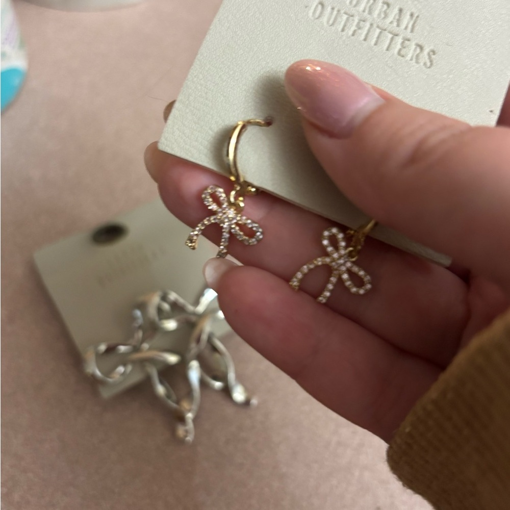 Gold Bow Hoop Earrings & silver bow earrings Urban Outfitters